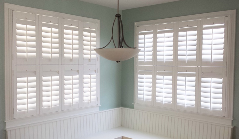 Soft green wall in Phoenix kitchen with shutters.